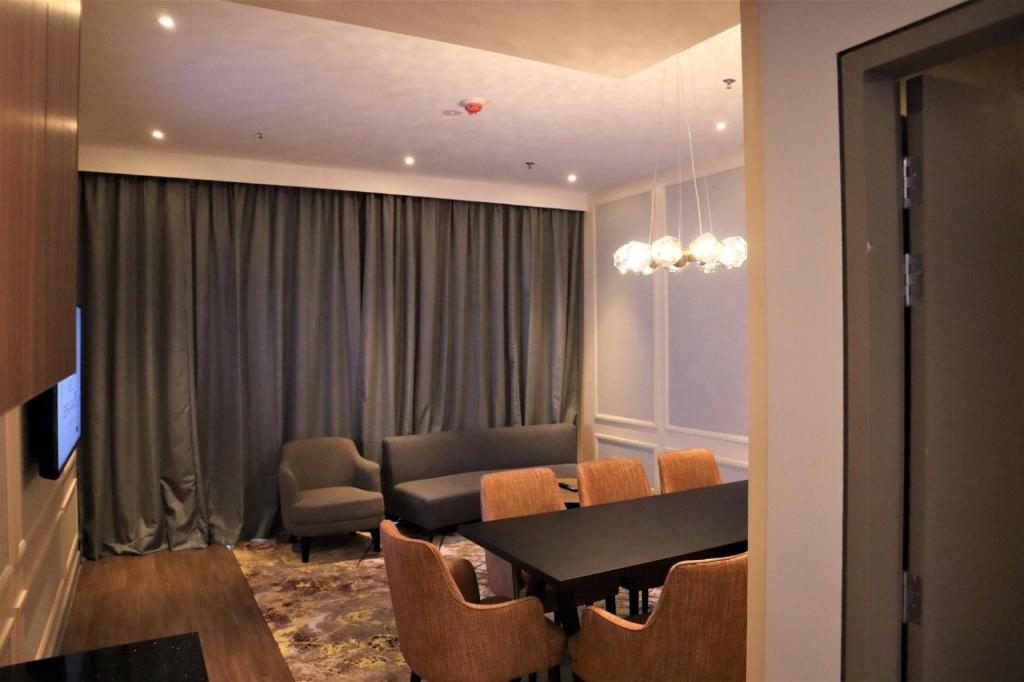 a dining room with a table and chairs at KSL ESPLANADE HOTEL with HOT SPRING in Klang