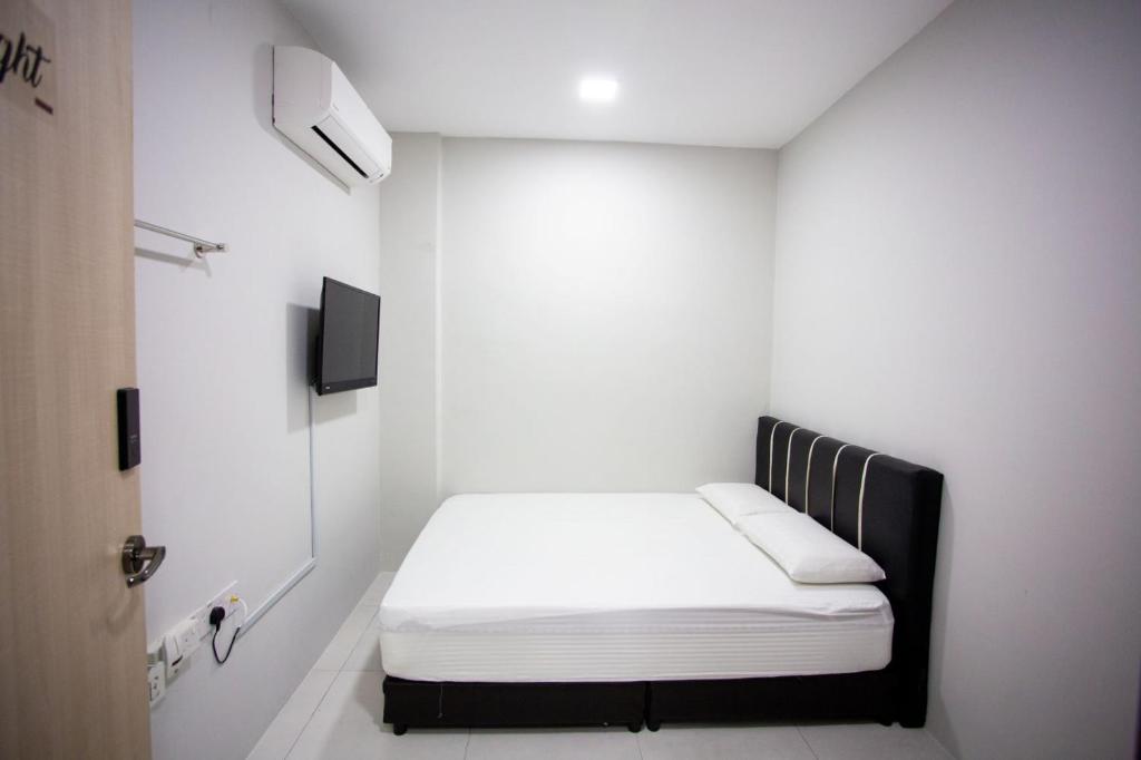 Letto o letti in una camera di Hom2rex Kuching Homestay Taman Timberland