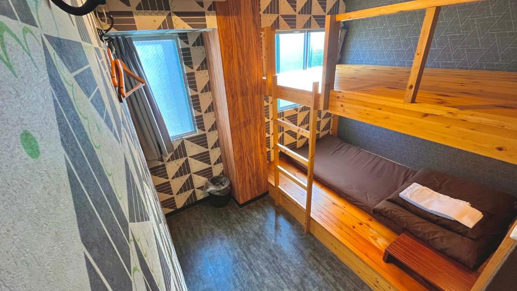 Postel nebo postele na pokoji v ubytování R Hostel Namba south