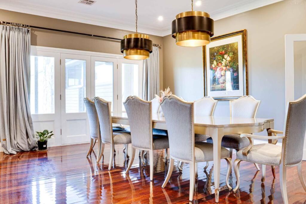 a dining room with a table and chairs at Heritage Holiday House No.15 in Wonga Park