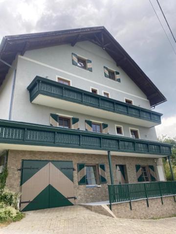 a large white building with a balcony on top of it at Pension Maximilian, Ideal für Gruppen in Gamlitz
