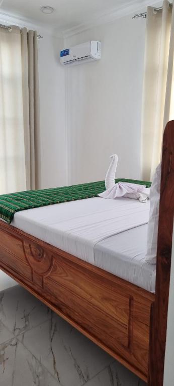 Postel nebo postele na pokoji v ubytování Terry's Villa Nungwi