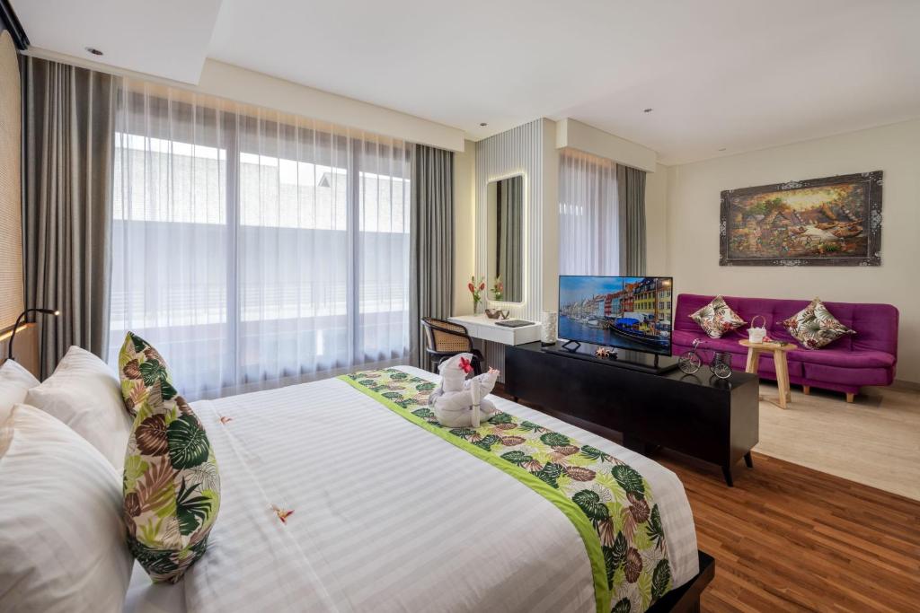 Postel nebo postele na pokoji v ubytování Mokko Suites Batubelig
