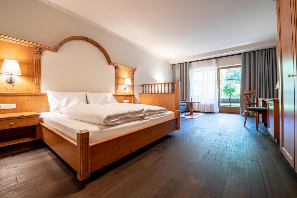 Postel nebo postele na pokoji v ubytování Naturhotel MOLIN