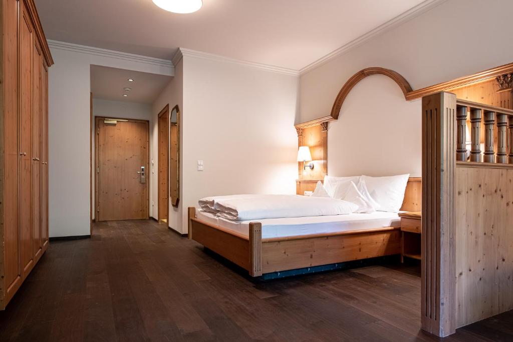 Postel nebo postele na pokoji v ubytování Naturhotel MOLIN