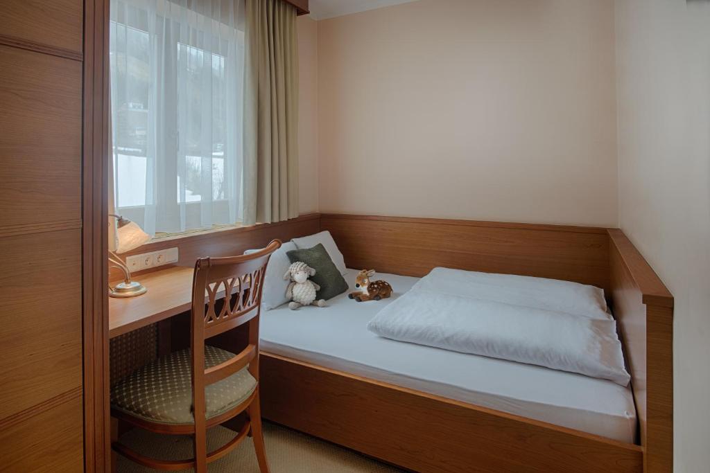 Postel nebo postele na pokoji v ubytování Naturhotel MOLIN