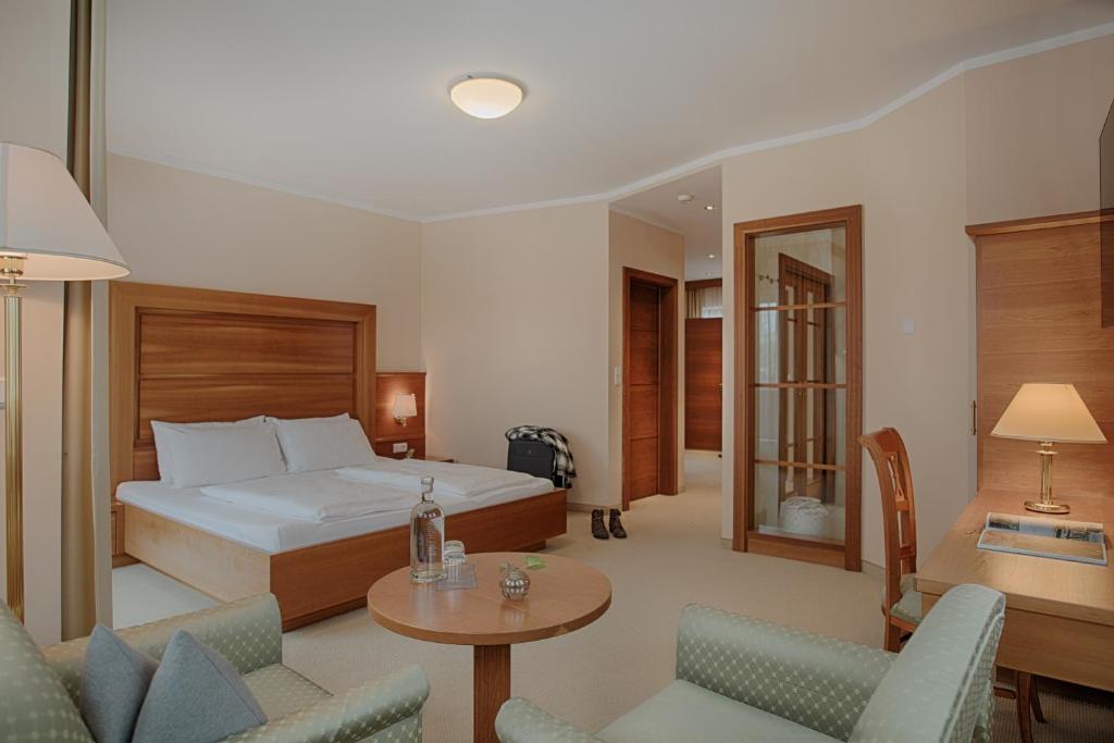 Postel nebo postele na pokoji v ubytování Naturhotel MOLIN