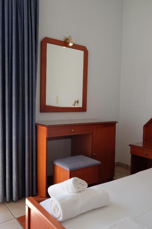 Postel nebo postele na pokoji v ubytování MIRSINI HOTEL