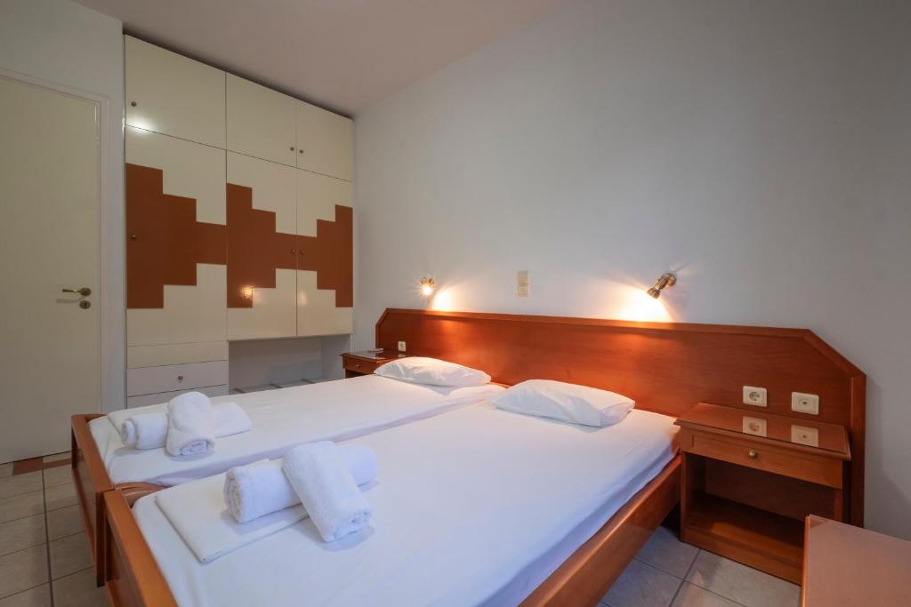 Postel nebo postele na pokoji v ubytování MIRSINI HOTEL