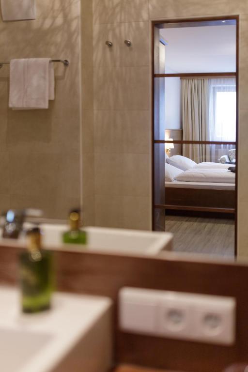 Postel nebo postele na pokoji v ubytování Naturhotel MOLIN