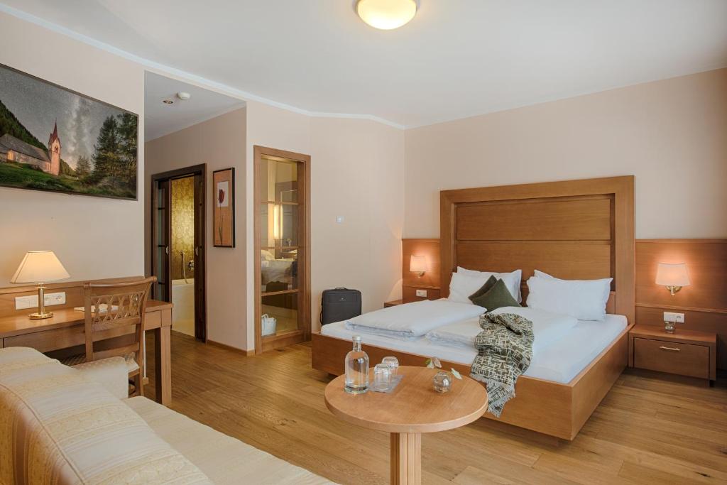 Postel nebo postele na pokoji v ubytování Naturhotel MOLIN