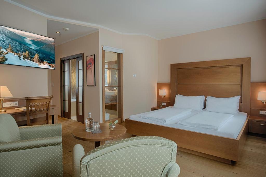 Postel nebo postele na pokoji v ubytování Naturhotel MOLIN
