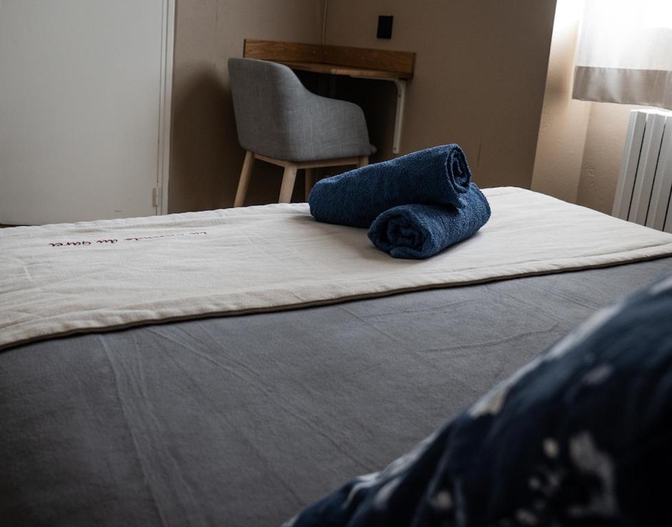 Postel nebo postele na pokoji v ubytování Gite Auberge Les Cascades
