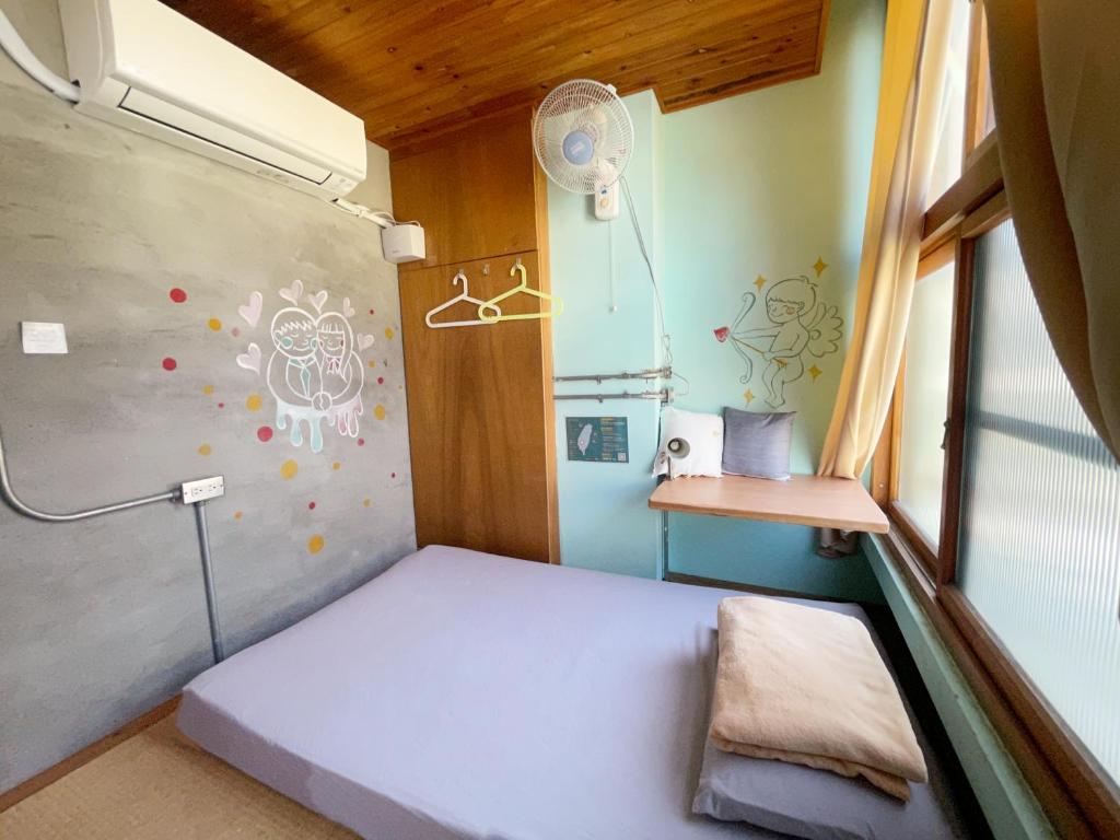 Postel nebo postele na pokoji v ubytování Fuqi Hostel - Heping