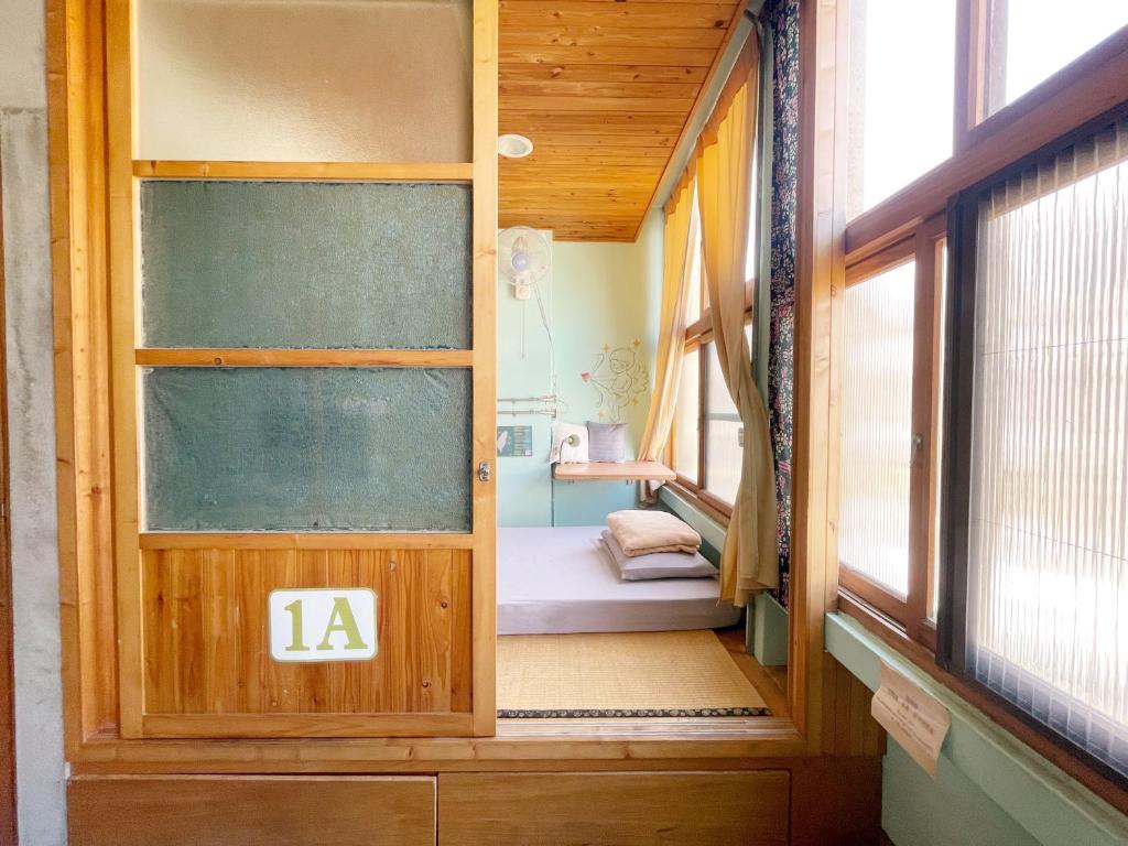 Postel nebo postele na pokoji v ubytování Fuqi Hostel - Heping