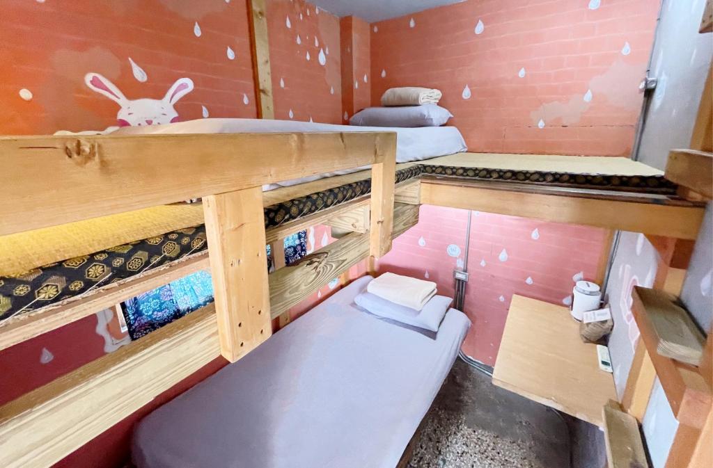 Postel nebo postele na pokoji v ubytování Fuqi Hostel - Heping