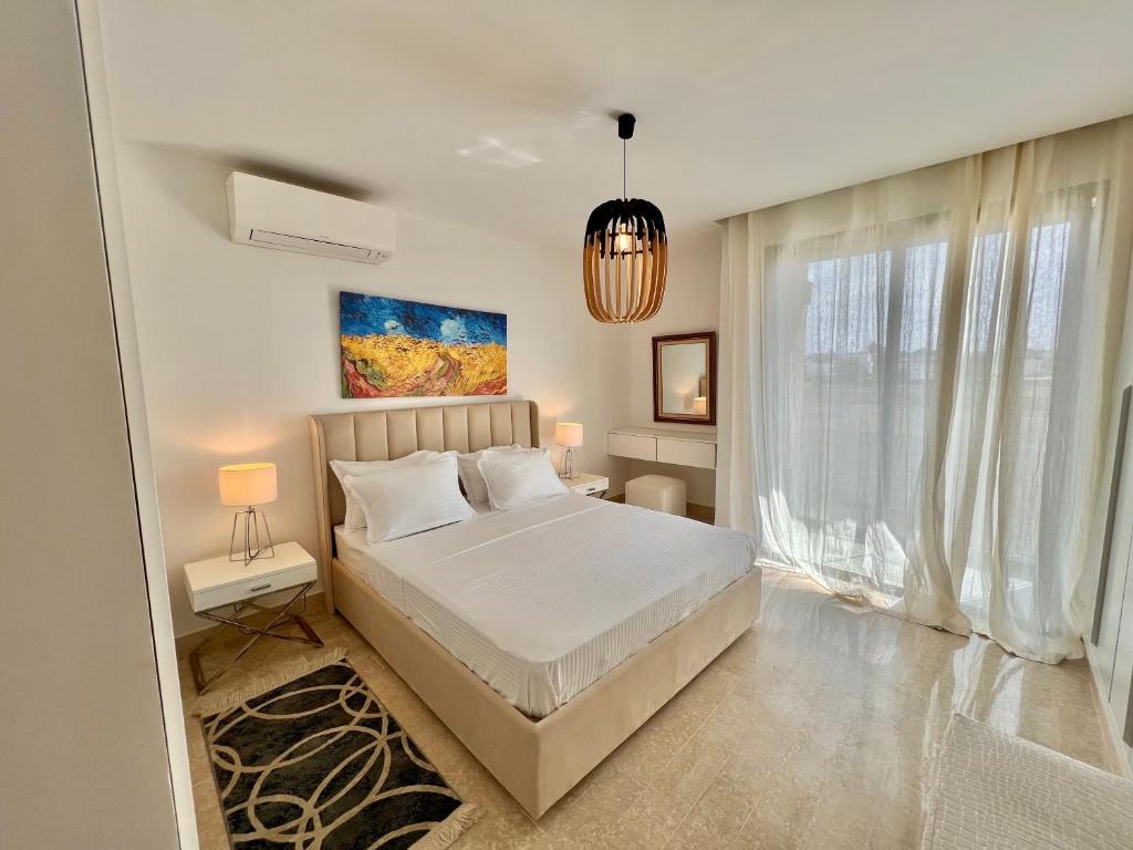 Postel nebo postele na pokoji v ubytování "Luxe Residence" Marsa avec Parking