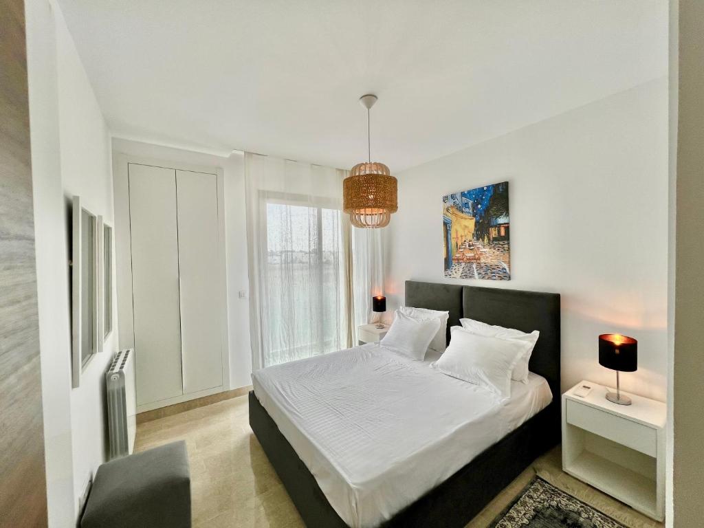Postel nebo postele na pokoji v ubytování "Luxe Residence" Marsa avec Parking