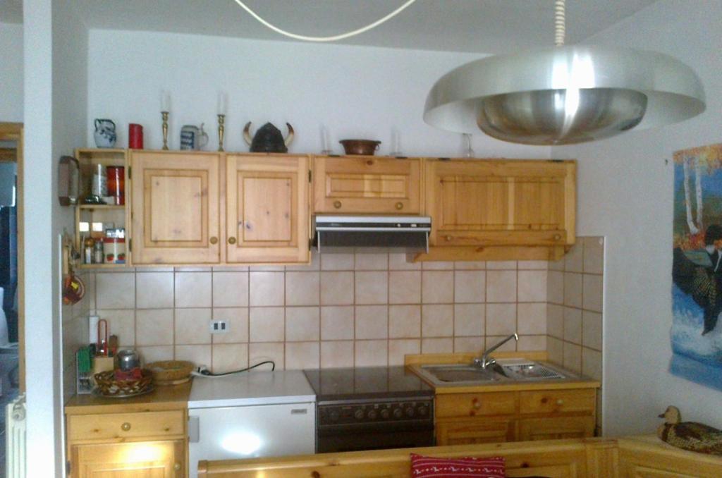 Een keuken of kitchenette bij Appartamento Condominio Panoramica