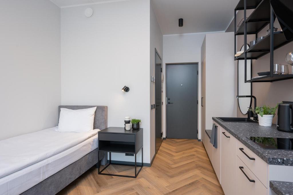 Kuchyň nebo kuchyňský kout v ubytování Rare Apartments - Self Check-In Miniapartments