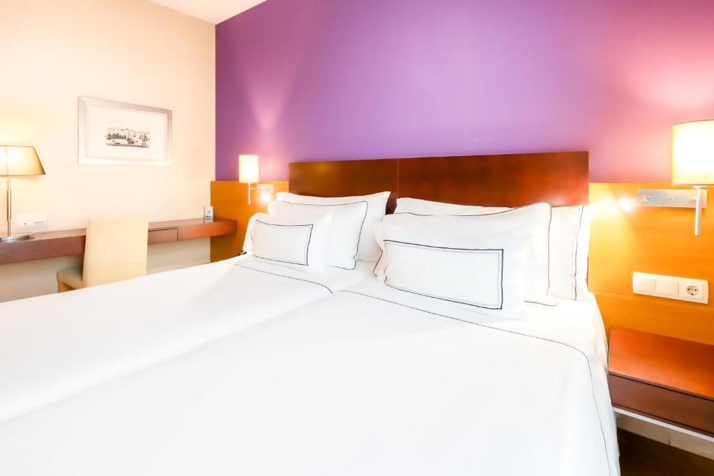 Posteľ alebo postele v izbe v ubytovaní Hotel Salamanca Montalvo