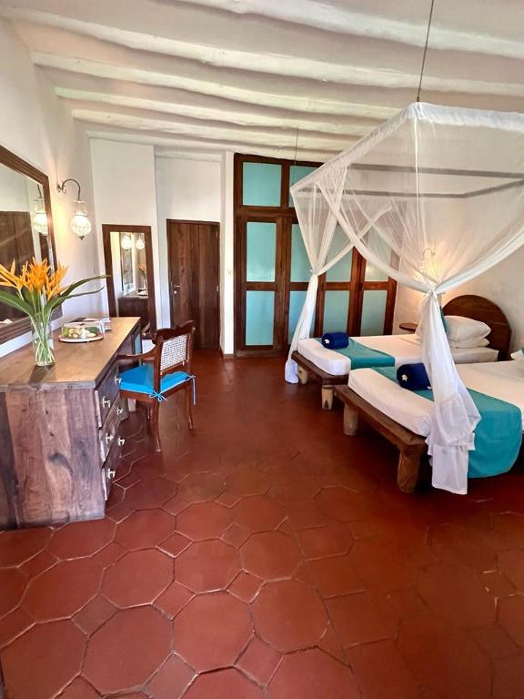 Postel nebo postele na pokoji v ubytování Hotel Club Dongwe