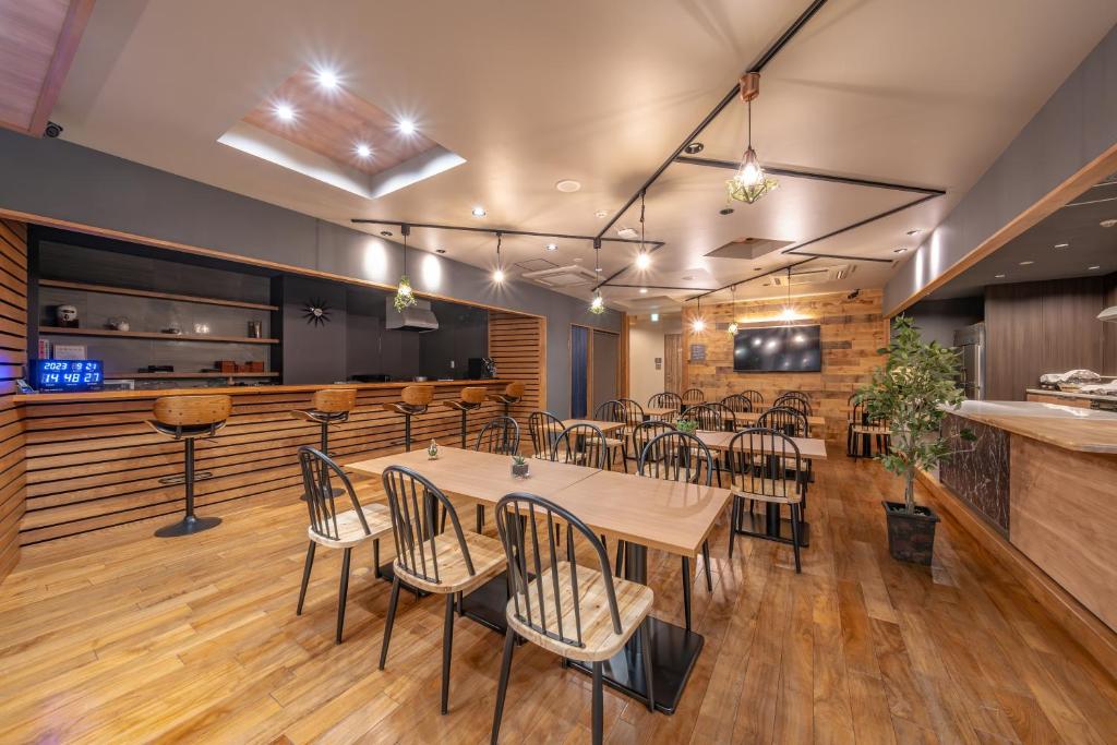 a dining room with a table and chairs at Relax Hotel Takayama Station in Takayama