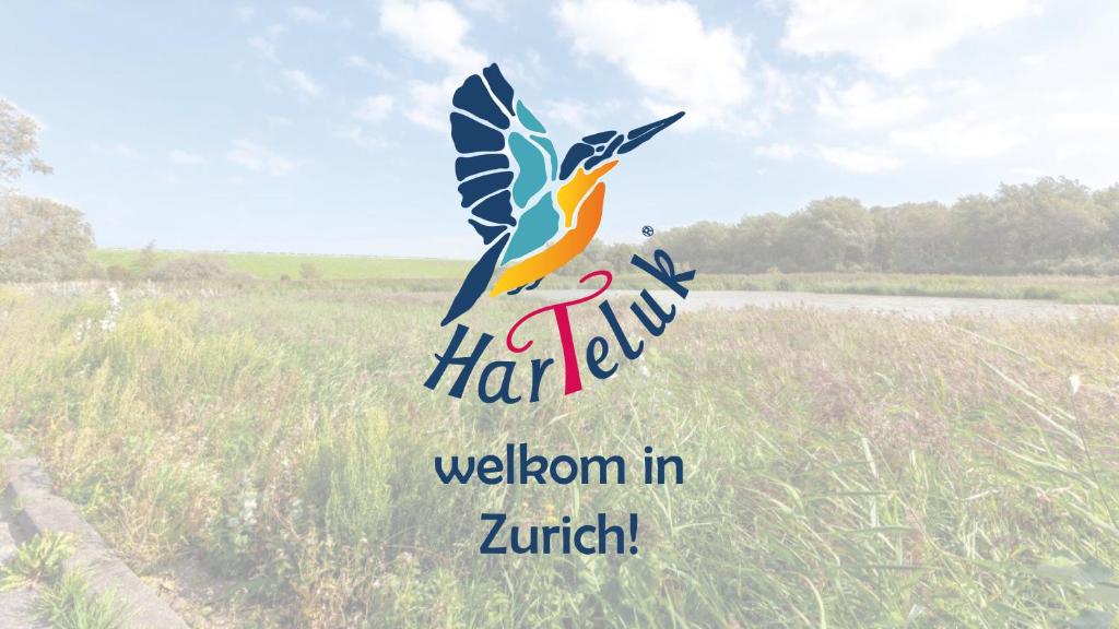 a sign with a bird flying over a field at HarTeluk Afsluitdijk Zurich in Zurich