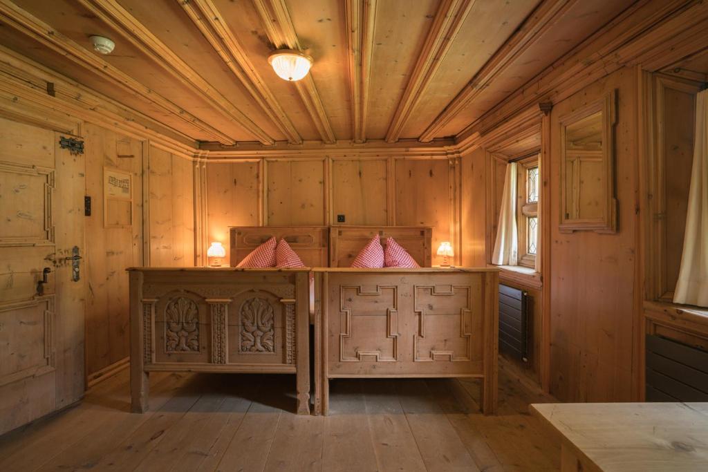 Postel nebo postele na pokoji v ubytování Gasthaus & Hotel Berninahaus