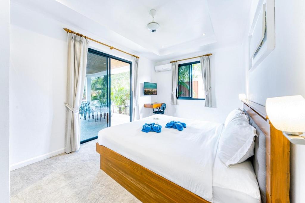 Postel nebo postele na pokoji v ubytování -20 Off per cent Luxury Mango Villa
