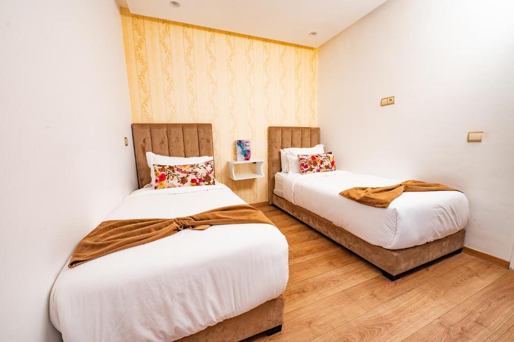 Postel nebo postele na pokoji v ubytování Family Aparthotel