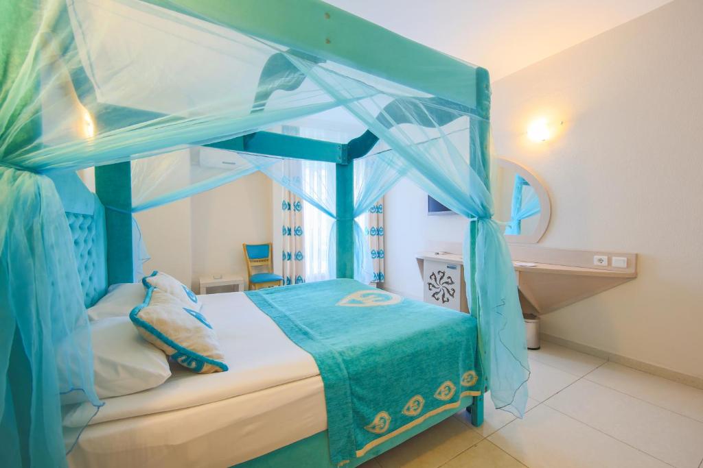 Postel nebo postele na pokoji v ubytování Daima Biz Hotel - Dolusu Aquapark Access