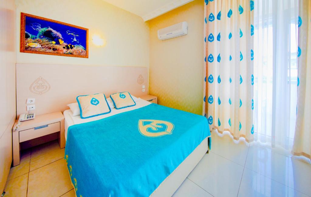 Postel nebo postele na pokoji v ubytování Daima Biz Hotel - Dolusu Aquapark Access