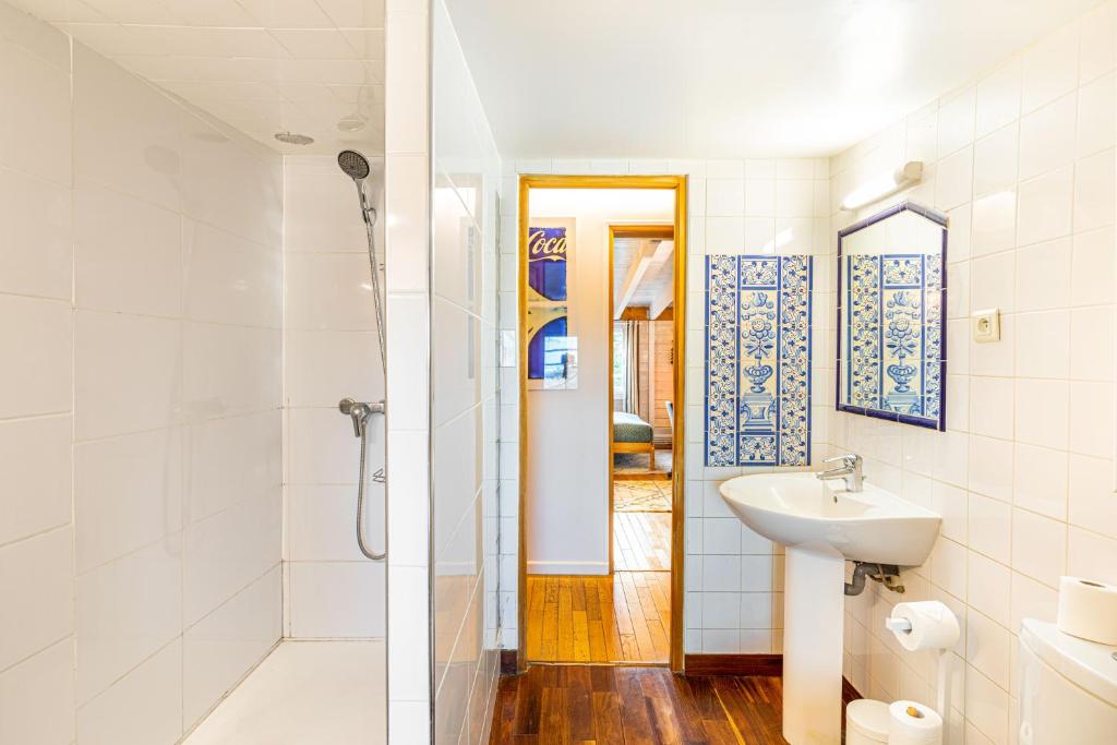 a white bathroom with a sink and a shower at Double Appartements 2&amp;3 210 sqm up to 18 guests, Villa des Ammonites in Meudon