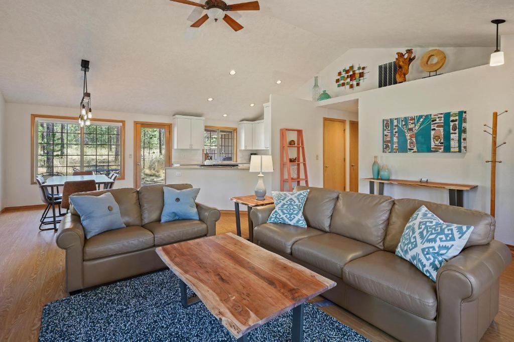 a living room with a couch and a table at 1 Sunrise in Sunriver