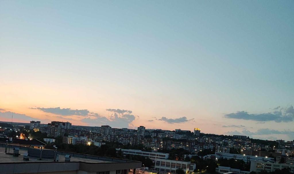 a view of a city at sunset at DB Luxury Apartment in Veliko Tŭrnovo