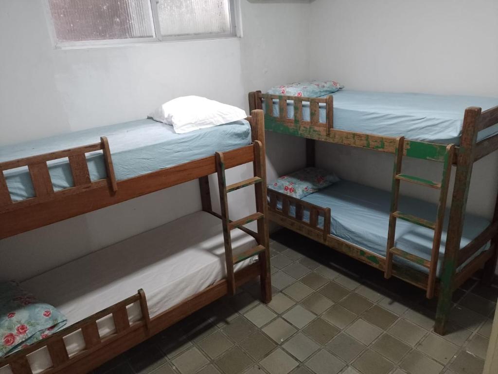 a room with two bunk beds and a window at hostel barra in Salvador