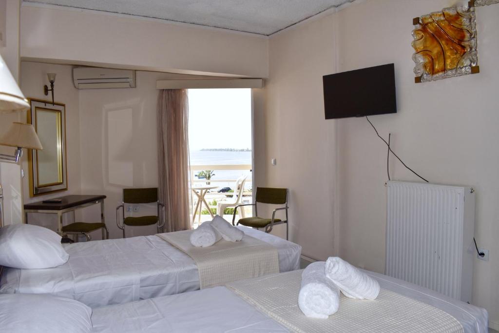 Postel nebo postele na pokoji v ubytování Hotel Theoxenia