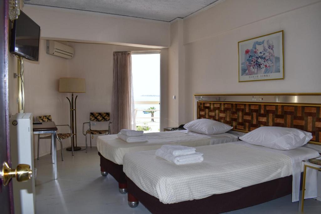 Postel nebo postele na pokoji v ubytování Hotel Theoxenia