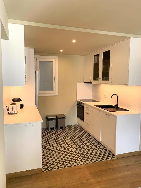 Kuchyň nebo kuchyňský kout v ubytování Apartamento en el centro de Puigcerdà