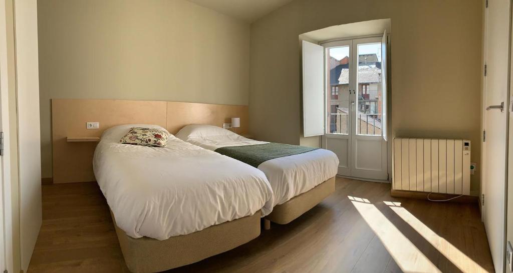 Postel nebo postele na pokoji v ubytování Apartamento en el centro de Puigcerdà