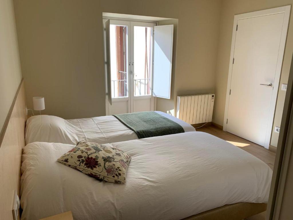 Postel nebo postele na pokoji v ubytování Apartamento en el centro de Puigcerdà