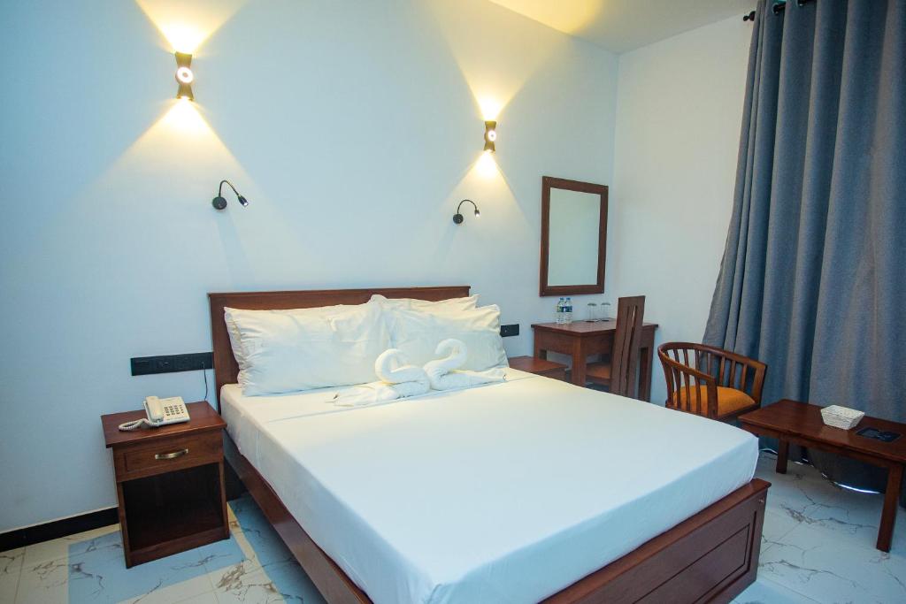 Postel nebo postele na pokoji v ubytování SHERON RESORT