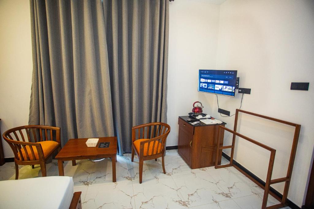 TV a/nebo společenská místnost v ubytování SHERON RESORT