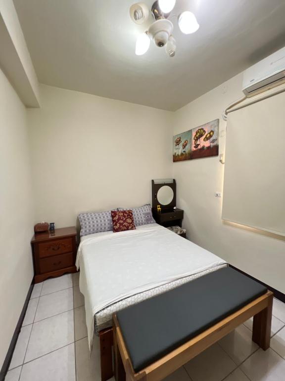 Postel nebo postele na pokoji v ubytování Jiajia Inn