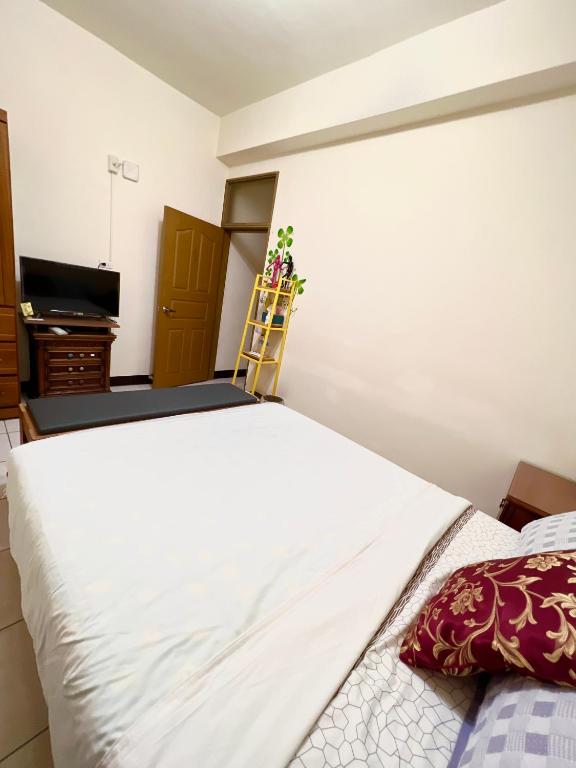 Postel nebo postele na pokoji v ubytování Jiajia Inn