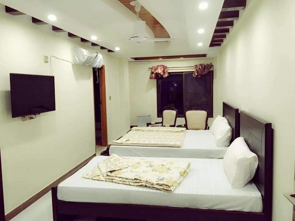 Postel nebo postele na pokoji v ubytování PAK HOTEL Islamabad