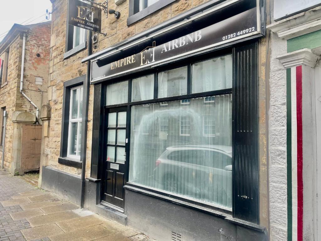 a window of a building with a car in it at Empire House in Burnley