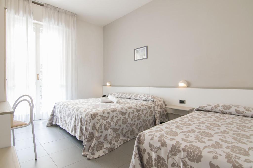 Postel nebo postele na pokoji v ubytování B&B Hotel Souvenir