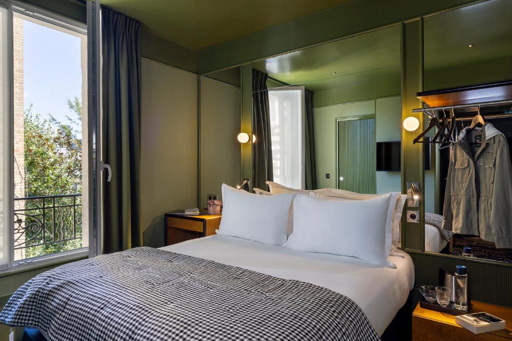 Postel nebo postele na pokoji v ubytování Hôtel La Conversation